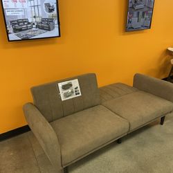 Sofa futon. Available in brown & grey. Assembly required. Assembly not included. Tax included. Free delivery.-$299.  Se habla español.