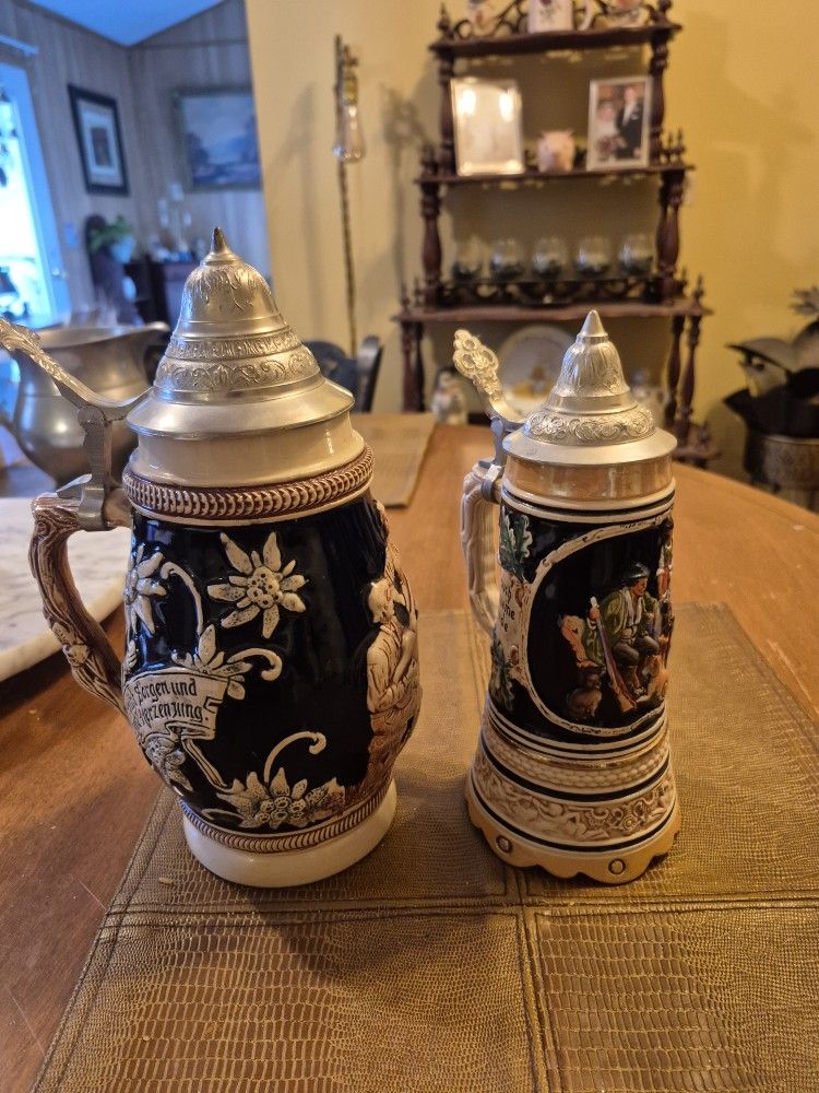 Two vintage west german beer steins with lids