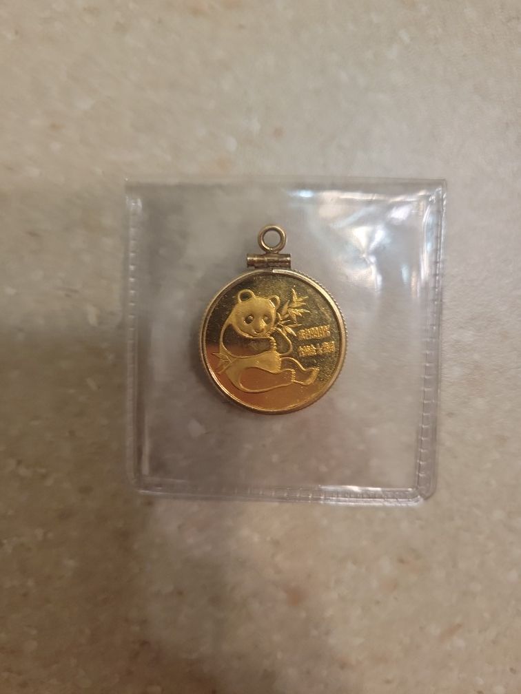 1982 Panda 1/4 Oz 999 Gold Coin Set In 14 K Gold Bezel.  Total Weight Is 9 Grams