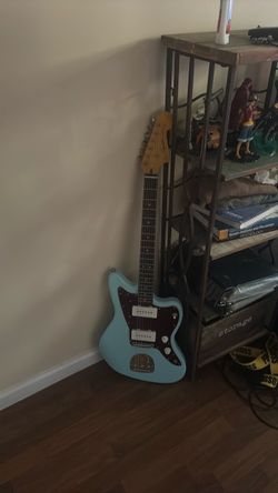 Blue Fender Squire Jazzmaster with P90 pickups.