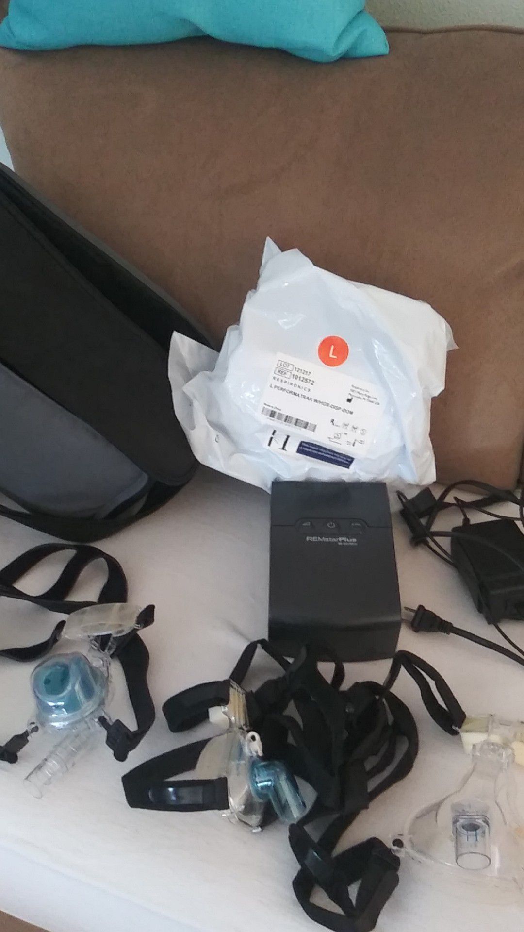 REMstar Plus CPAP machine with accessories.