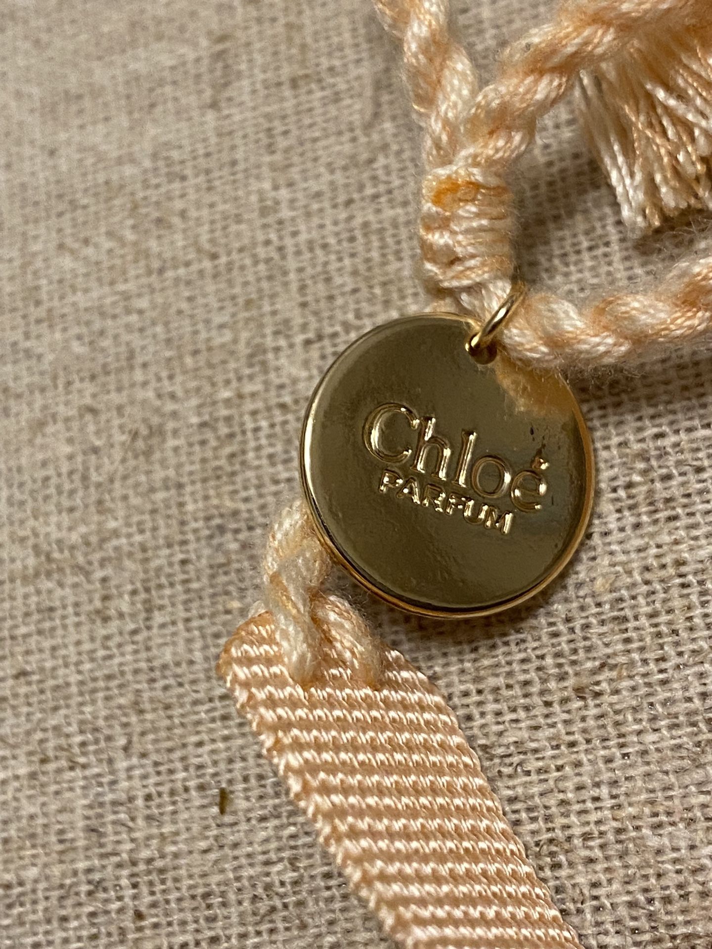I am Chloe pink fabric bracelet with charm Chloe perfume...