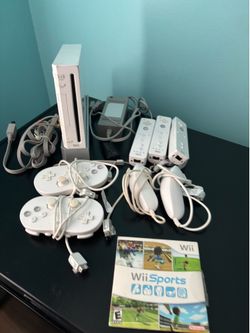 Wii console with xtra handles and sports pack n outdoor challenge
