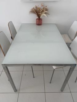 Glass table and 4 chairs for sale