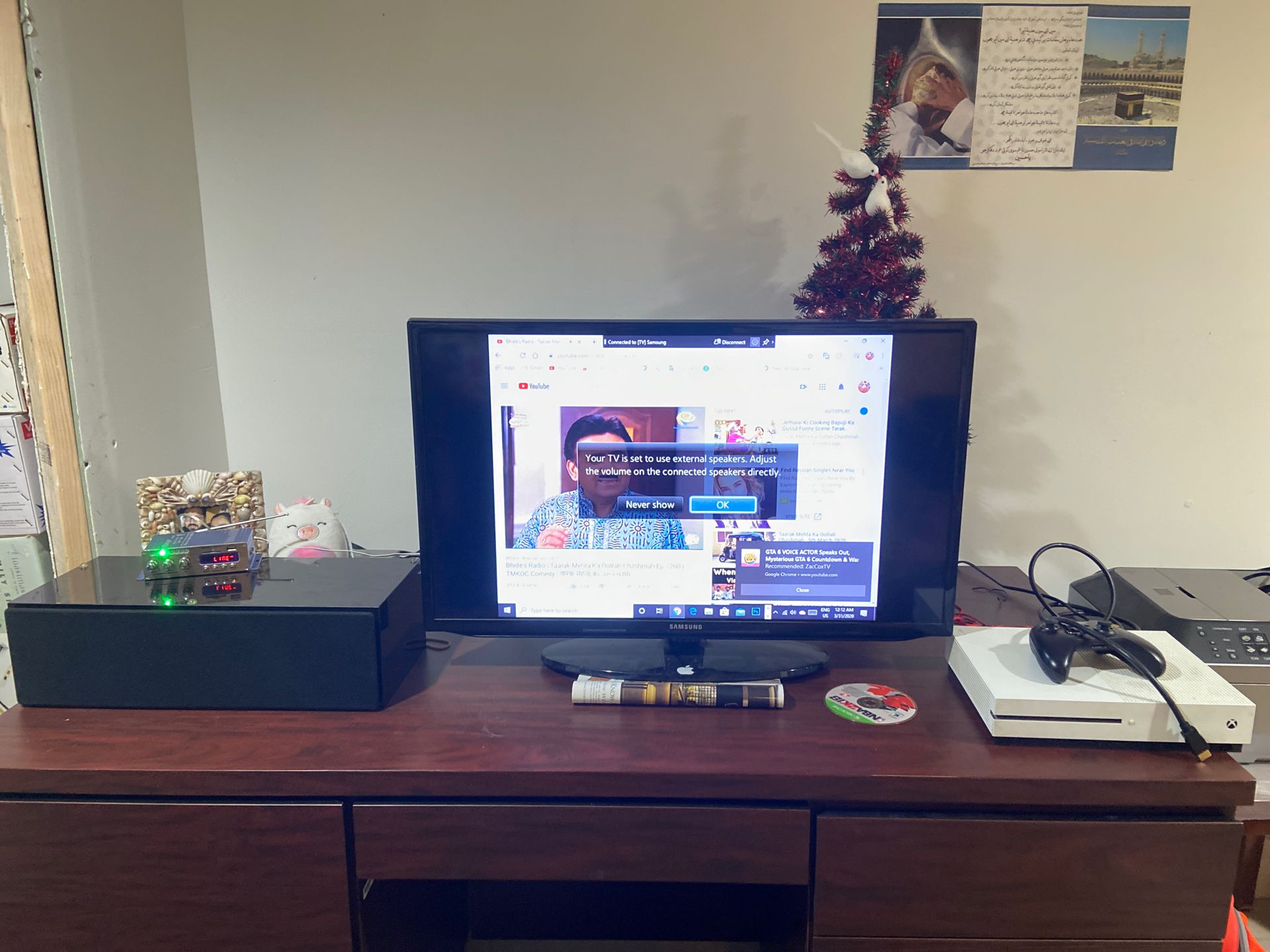 A 32’ inch Samsung Smart TV and a speaker with an amplifier