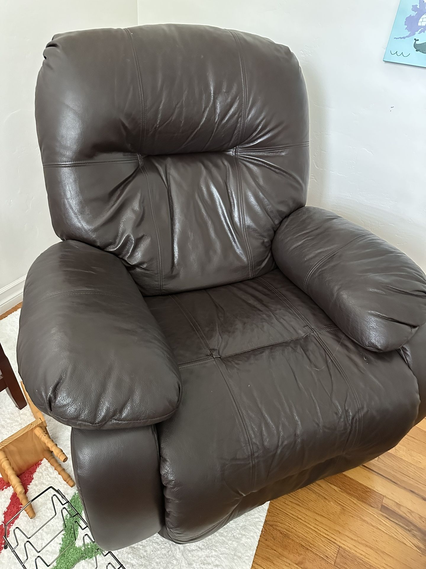 brown swivel recliner rocker from living spaces