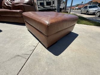 Brown leather ottoman