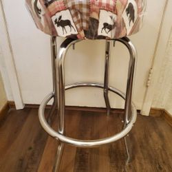 COUNTRY SWIVEL STOOL (HAS SMALL SLIT IN SEAT)  27 1/2" X 19" WIDE.   SEAT IS 14 1/2" WIDE