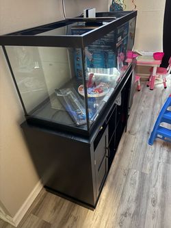 BRAND NEW 75 gallon marineland, fish tank stand , python no spill, heater, sand , freshwater master test kit.