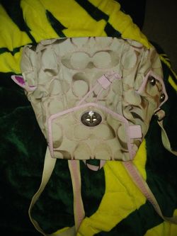 BEAUTIFUL COACH PURSE-BACKPACK PURSE! paid 250.00 asking 75.00 used 1 time for half a day. New condition. No wear or tear on it.