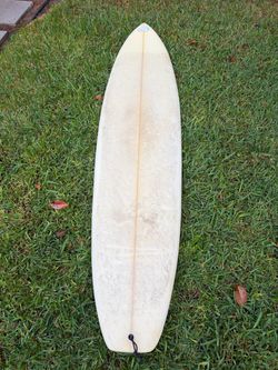 7’’0” mid length surfboard