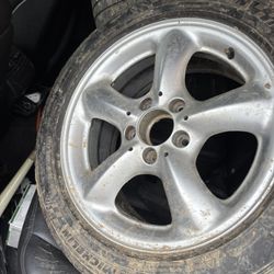 205R 16 in the front and 225R 16 in the back all four rims and tires