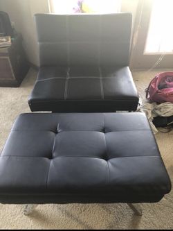 Contemporary black chair and ottoman
