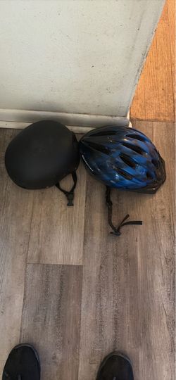 Two Used Bike Helmets – Black and Blue