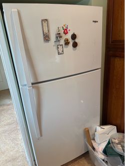 white Whirlpool top-freezer refrigerator