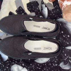 black Toms slip-on shoes