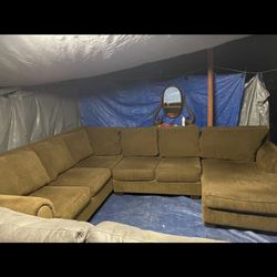 Goldish brown sectional couch good condition very clean myself all the time will deliver for an extra fee
