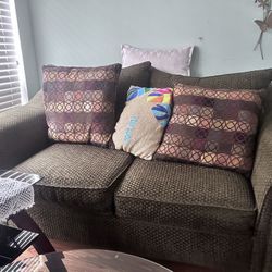 Two coaches with the pillows and three table they are in good shape