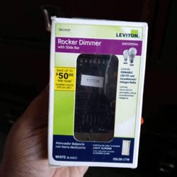 brand newrocker dimmer with slide bar in a green box