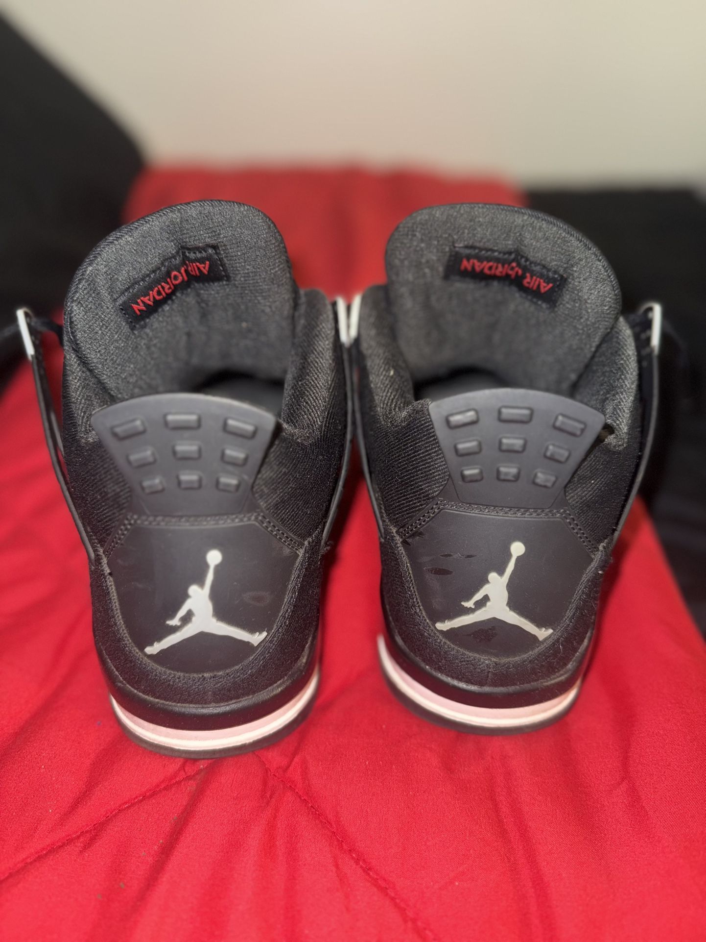 Black Canvas Jordan 4s 