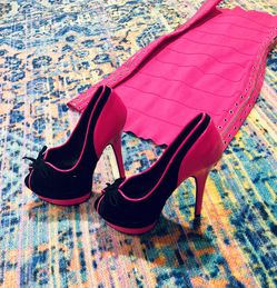 Valentine’s Day pink bandage dress and black stiletto heels