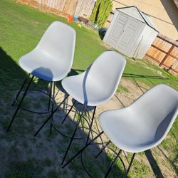 High chairs swivel all around grey plastic used for high top counter