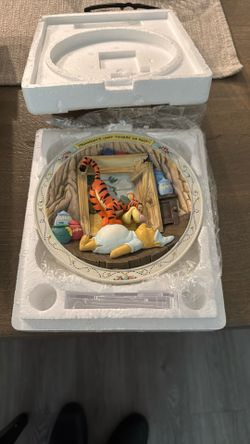 A collectible 3D plate featuring Winnie the Pooh characters, titled 'Three Cheers for Pooh'.
