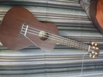 Makala Baritone ukelele musical instrument needs one string replaced