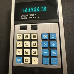 Vintage Unisonic 737 "Slide Rulette" electronic calculator. Based on the information available, here are some key details about it:  * Model