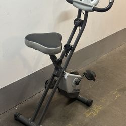 The Stamina Folding Exercise Bike 182 is a compact, affordable indoor upright stationary bike featuring eight levels of quiet magnetic resistance, bui