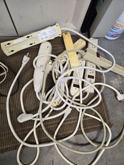 Assorted power cords, extension cords and power strips