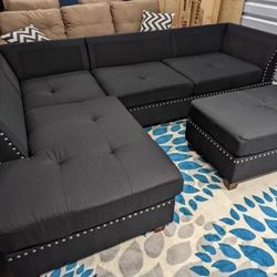 New Reversible Nailhead Sectional .  Black .  104” X 75”.  Free Delivery !