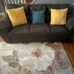 2 Section Sofa  Grey In Color 