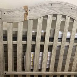 Premium convertible crib, suitable for ages 1 to 4 years, in wood color, includes mattress, very little use.