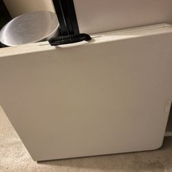 white fold-in-half utility table