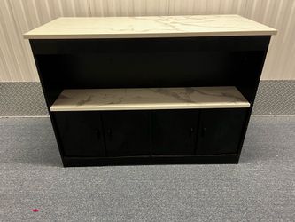 Black sideboard with faux marble top