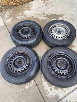 Five lug 15 inch rims with (contact info removed) tires