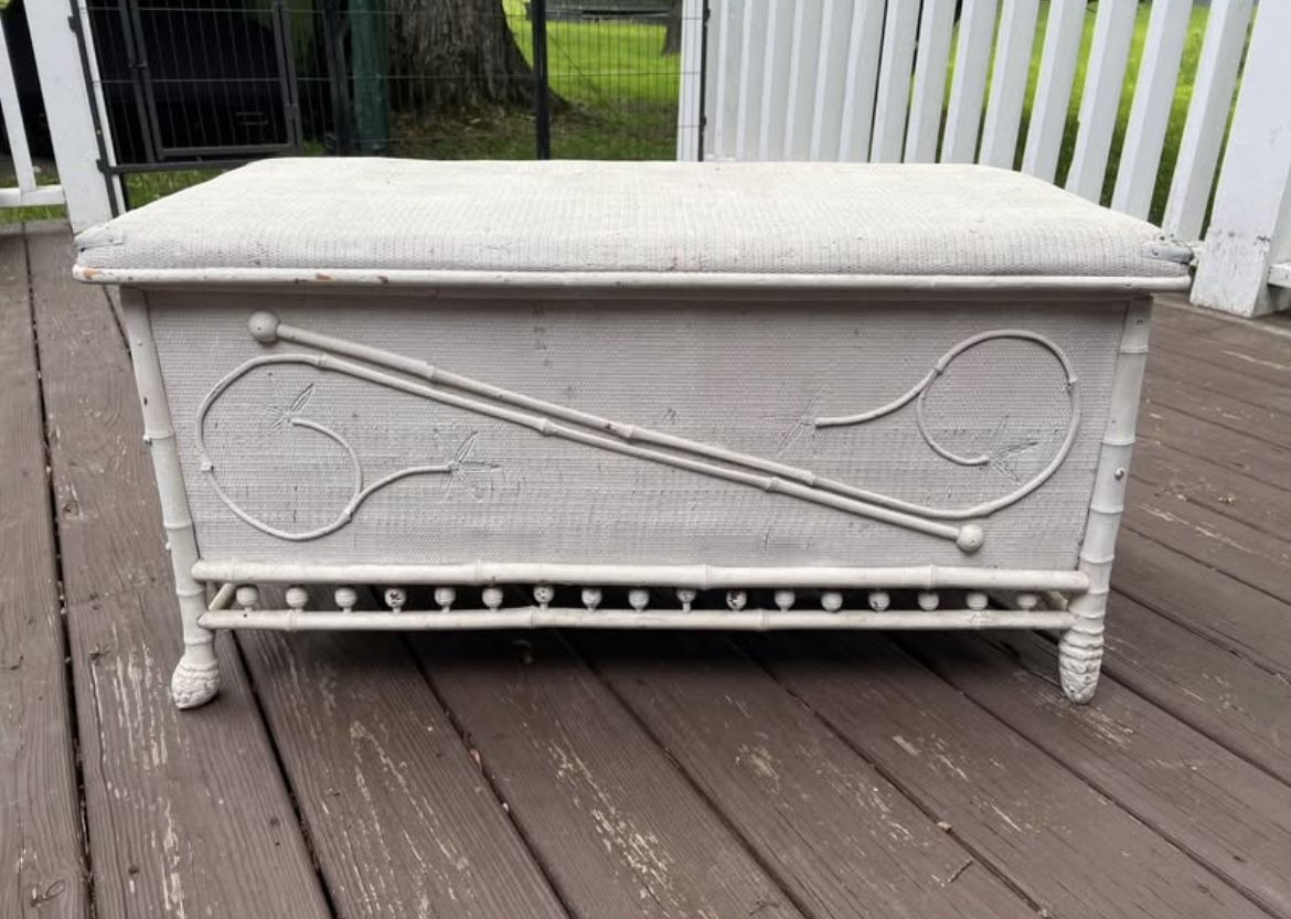 Lovely old white wicker or nightly embellished chest with lid. Sturdy piece.