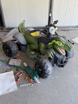 Dino electric tide on kids quad car