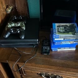 Ps4 pro with 11 games and 3 controllers and a charger 