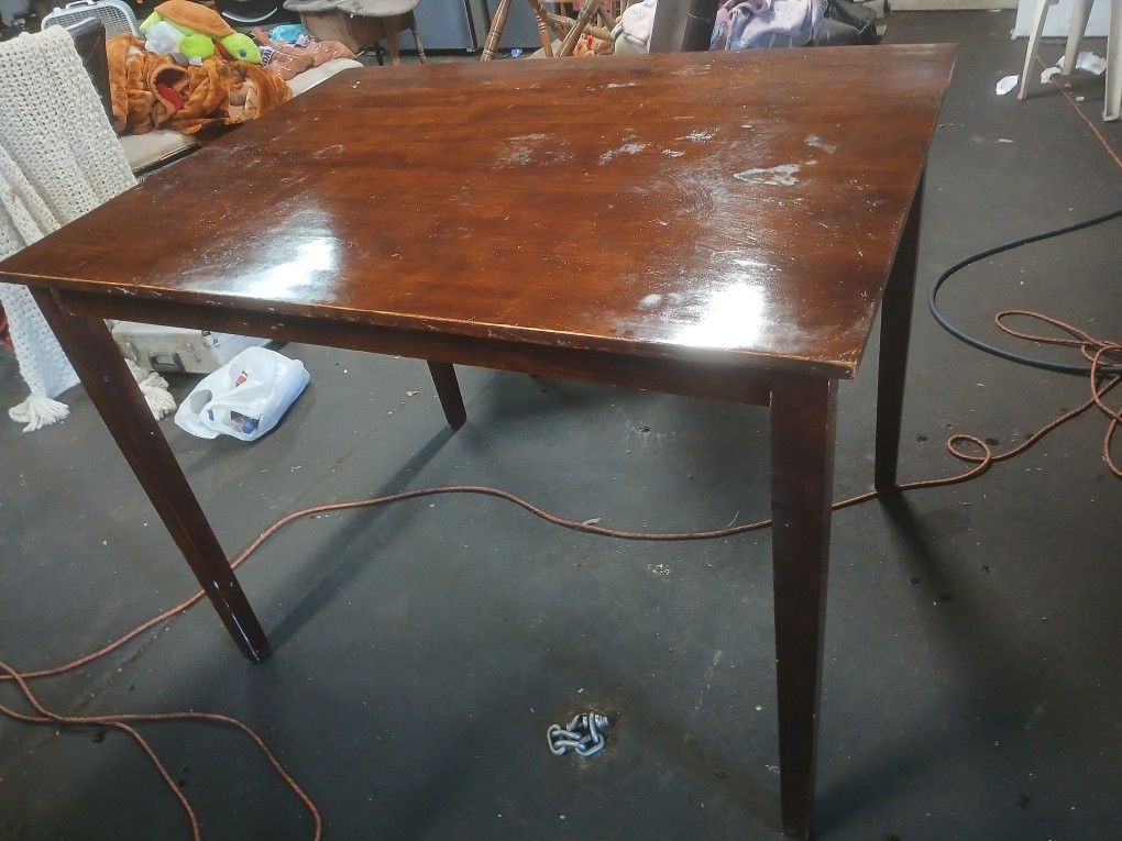 Table and good condition made for bar stools.