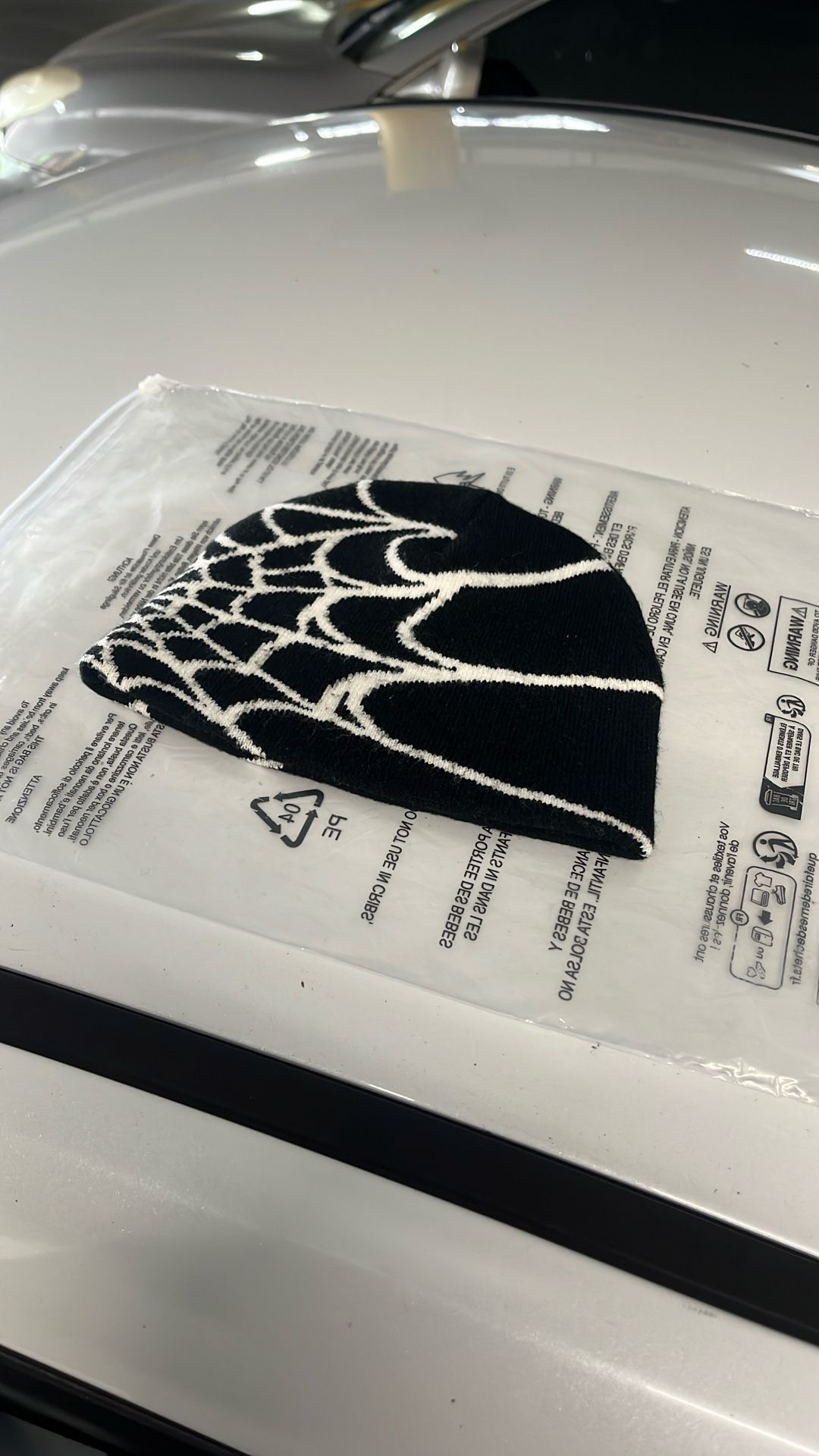 Black and white spiderweb beanie