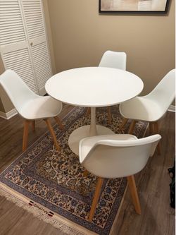 Modern white circular dining set