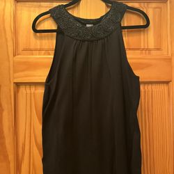 Brand new Ann Taylor sleeveless top. Embroidered color.  Beautiful design. Color black. Size Large. 76 percent silk and 24 percent nylon. Very stylish