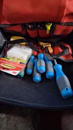 Milwaukee  back pack with alot of tools and nail gun