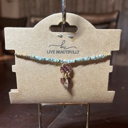 Beaded Bracelet with gold charms