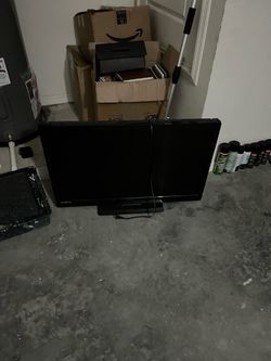 Black Flat Screen TV with Stand