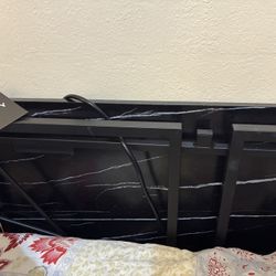 DKNY Black Desk/white Swirls. Outlet Plug. 