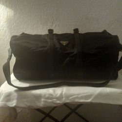 Prada Weekend Bag, Black Nylon and Leather with shoulder strap, lock and key.