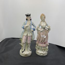 Two vintage Victorian porcelain man and lady figurines